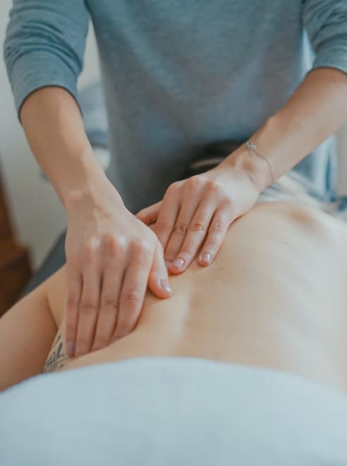 close up of hands on person being given a massage
