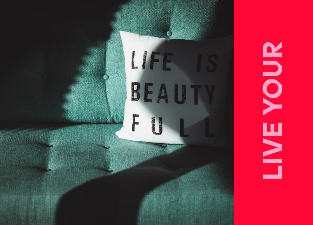 teal sofa, matching cushion with motif 'life is beautiful'